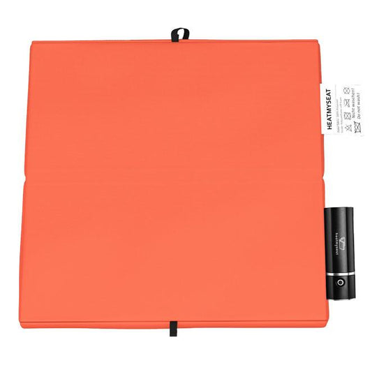 The stylish outdoor heating pad in the colour orange - cordless, with battery and mobile